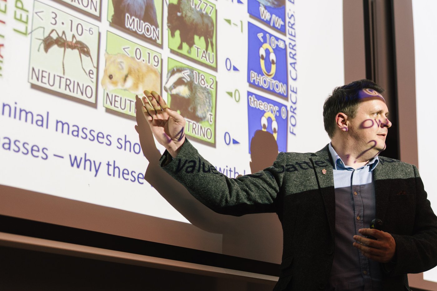 Darren Price presenting on particle masses to a public audience