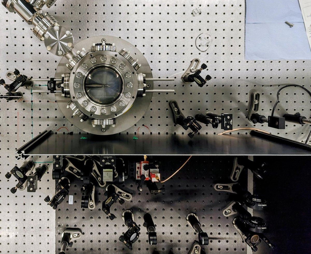Optomechanical levitating-sensor vacuum chamber and optics table